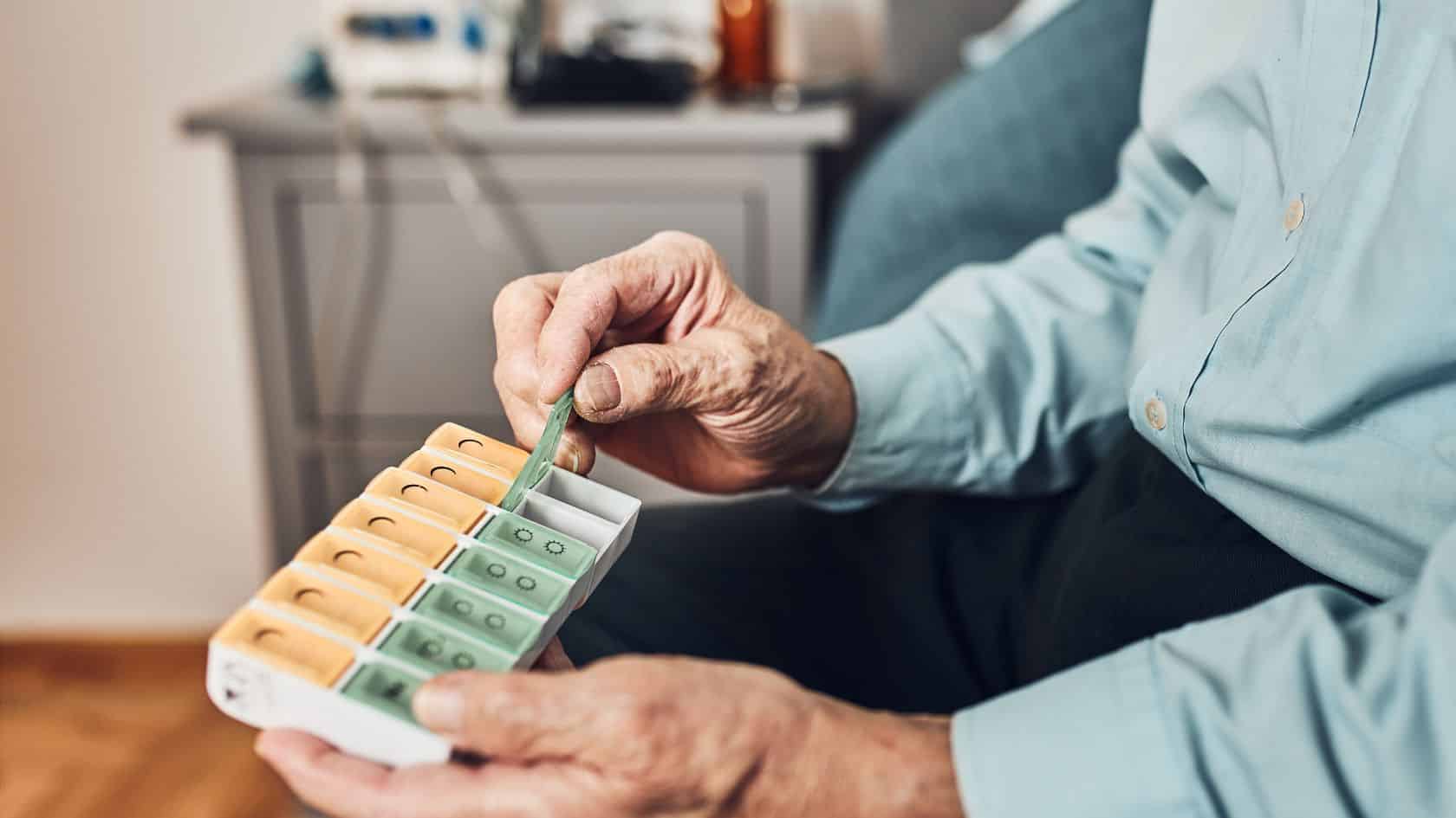Elderly person with their medication pack