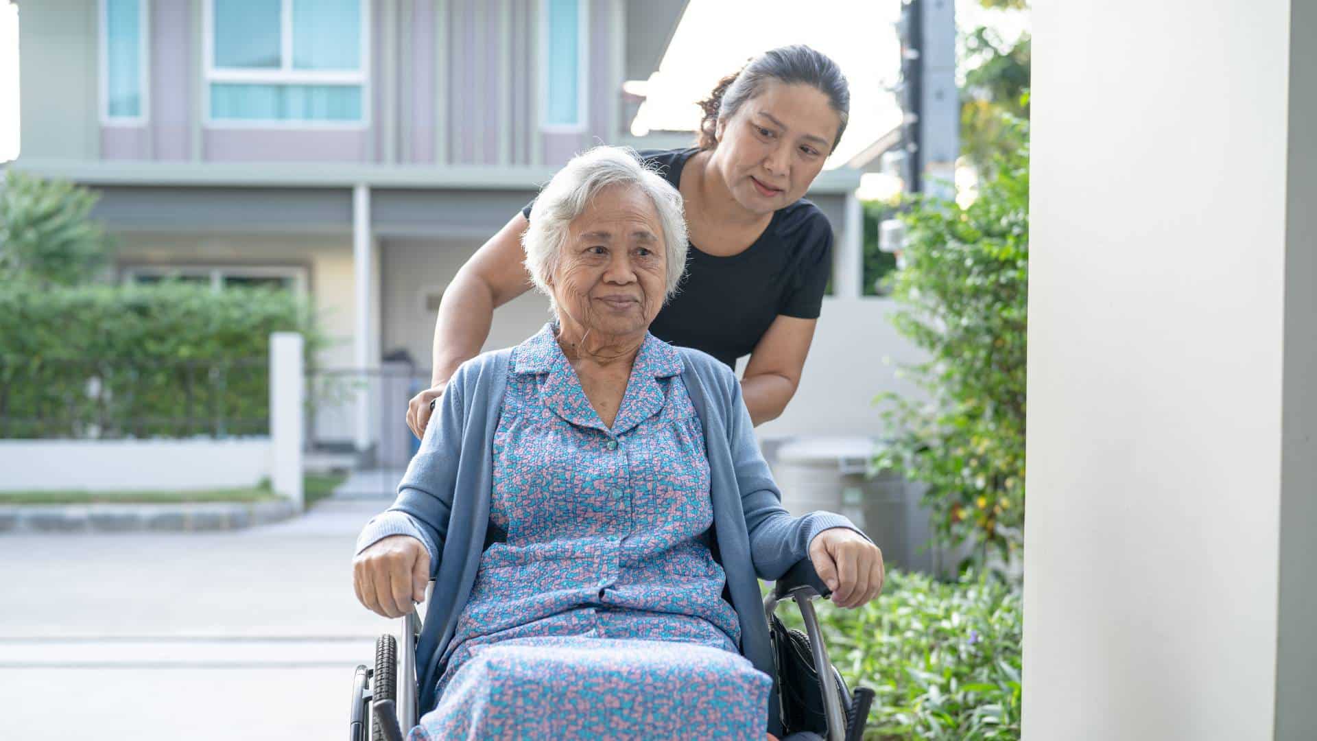 carer with aged care patient in wheelchair